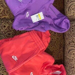 2 girls size small tracksuits, both brand new with tags. One purple one pink!